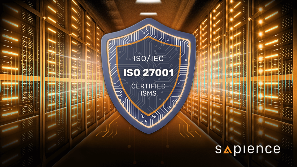 A digital illustration of a strong blue and orange shield, featuring the text 'ISO/IEC 27001 Certified ISMS' and a circuit board pattern, placed prominently in the center of a brightly lit data center aisle with glowing server racks. The image symbolizes information security and compliance protection within critical infrastructure.