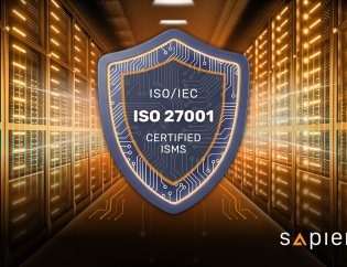 A digital illustration of a strong blue and orange shield, featuring the text 'ISO/IEC 27001 Certified ISMS' and a circuit board pattern, placed prominently in the center of a brightly lit data center aisle with glowing server racks. The image symbolizes information security and compliance protection within critical infrastructure.